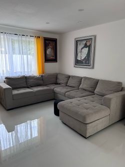Gray 6-Person Sectional Sofa with Pull-Out Bed + Storage
