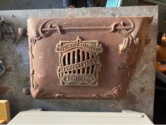 antique National Stoves & Ranges cast iron stove or door.
