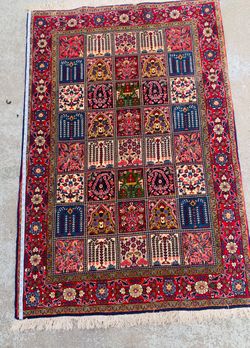 Hand knotted wool & silk rug
