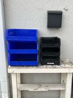 Blue Storage Bins and Black Husky Bins