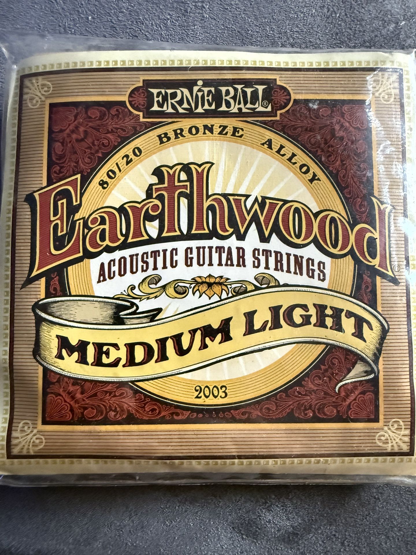 ERNIE BALL NEW EARTHWOOD MEDIUM LIGHT ACOUSTIC GUITAR STRINGS 12-54