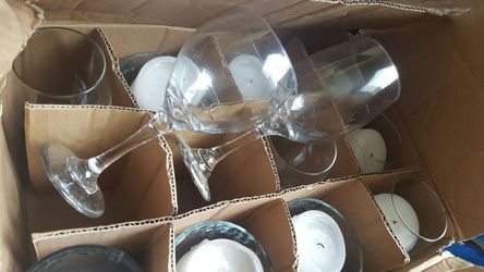 Assorted wine glasses and candle holders (used once)