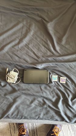 3ds XL bundle with Pokémon alpha sapphire and ultra moon as well as charger