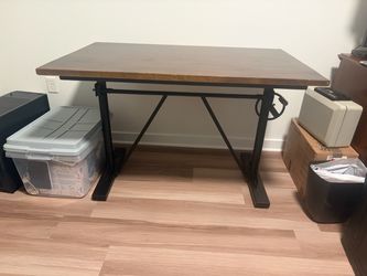 Adjustable height desk