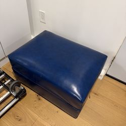 Blue ottoman on wheels