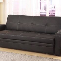 black faux leather folding futon sofa bed with built in cup holders in the arms  