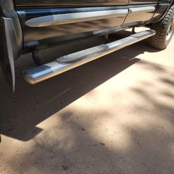 Dodge Ram steps and mud flaps.