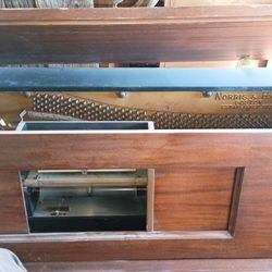 Upright playing Piano with music