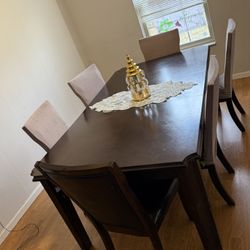 dark wood dining table and 6 chair set