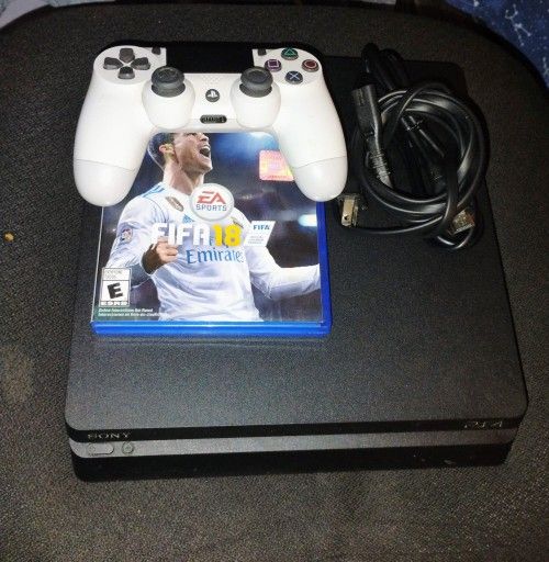 PS4 Slim With A Controller And A Game