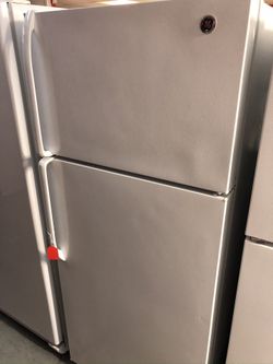 Used GE top and bottom fridge. 1 year warranty