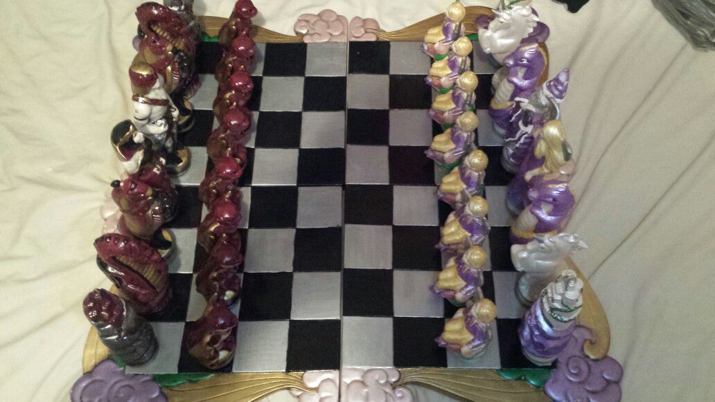 Chess set. ceramic board not sure what the pieces are