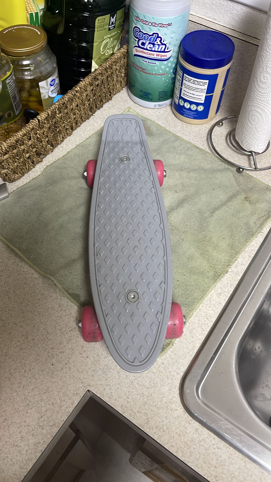 a 17-inch mini cruiser skateboard in a Penny-style design, featuring a gray deck and pink wheels.