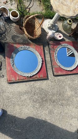 Ornate Oval Wall Mirrors on Rustic Wood Backing