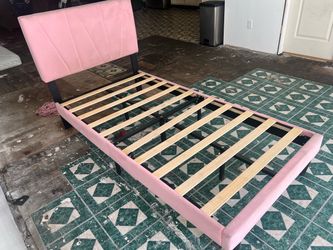Pink bed frame with mattress