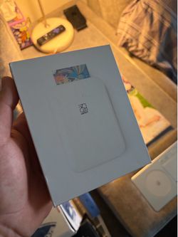 New HPRT portable photo printer in original white packaging. This compact device is designed for mobile printing.