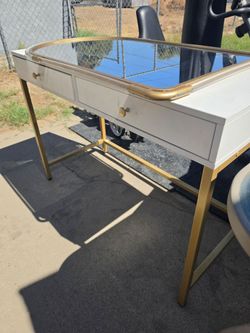 Vanity with gold trimestre and Mirror