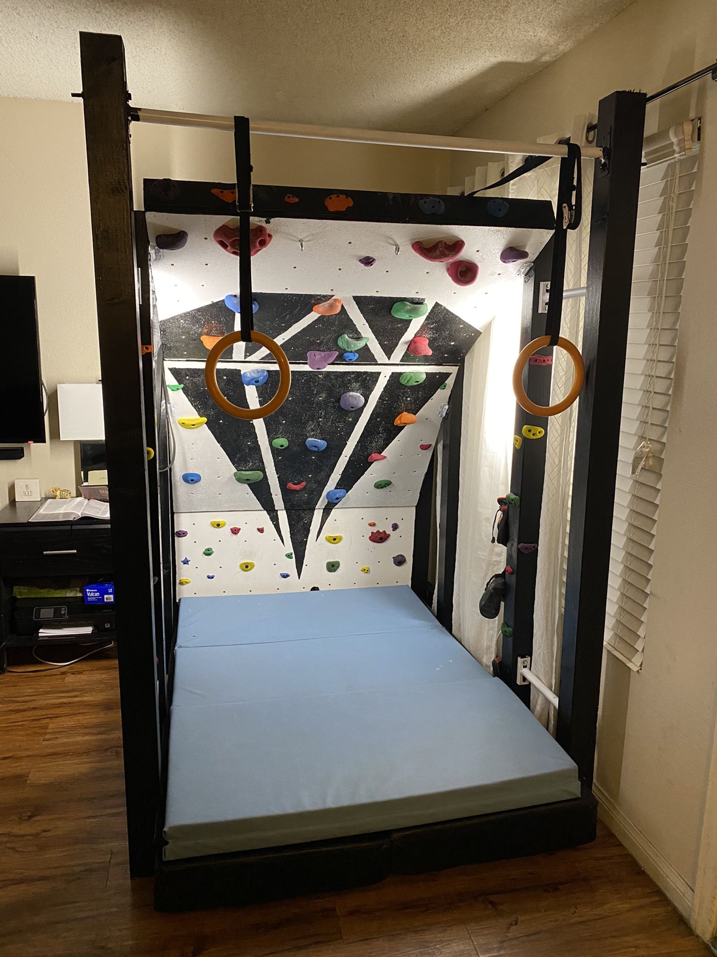 Climbing wall with pull up bar