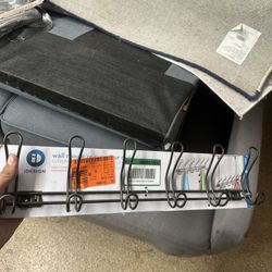 iDesign (formerly InterDesign) Classico or Mainstays over-the-door 6-hook rack. It is a metal rack designed for hanging items like coats, towels, robe