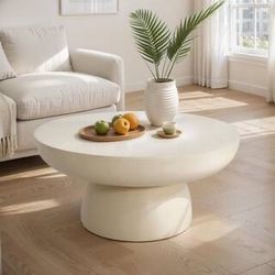 Beige plaster round coffee table