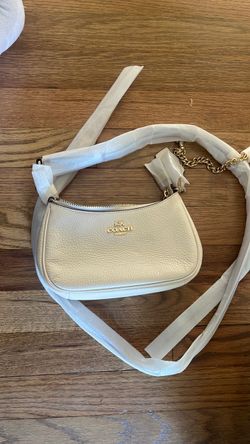 Teri shoulder coach bag cream color