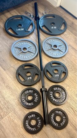 Beautiful NEW Equipment: 6 ft Steel Olympic Bar with Pairs of Weight Plates: 45s, 35s, 25s, 10s and 5s. Total: 282 lbs