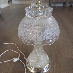 vintage Crystal Clear Industries or Kristal Zajecar 24% lead crystal boudoir table lamp with a floral cut and etched pattern and a brass base. 