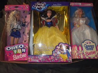 Three Barbie dolls in the box.. the price is firm