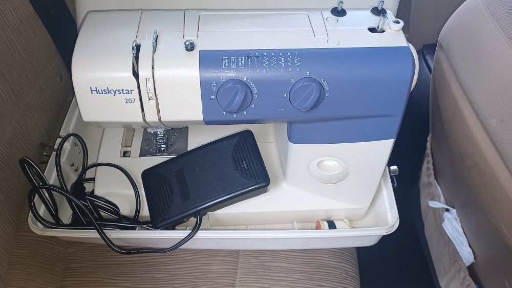 A Sewing Machine And Thread Serger Machine 