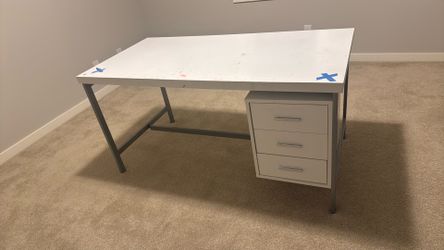 2 identical white computer desks with 3 shelves