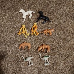 Lot of 9 vintage toy animals. 2 horses, 2 monkeys, 2 emus, 1 tiger and 2 gazelles. They are all plastic and from various eras. 