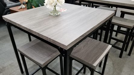 Grey top table with 4 stools
