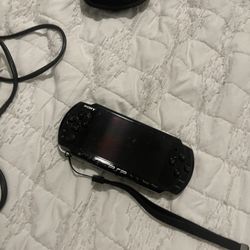 PSP With Charger And Games 