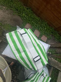 Green and white outdoor pillows
