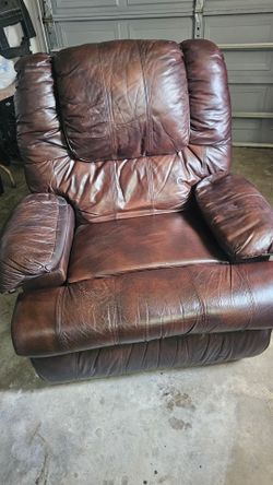 Brown leather swivel recliner in good condition