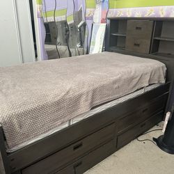 Twin bed with book shelf head board and understorage