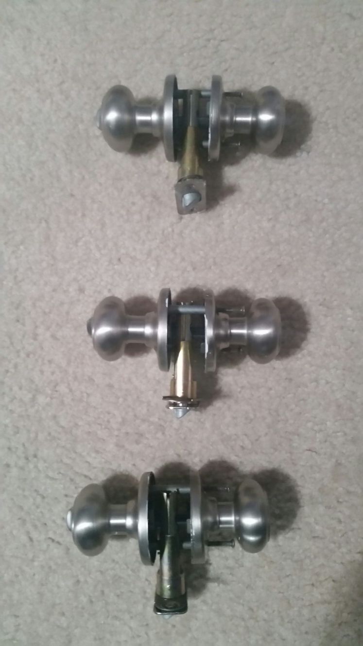 Kwikset bed and bath knobs. Stain finish.