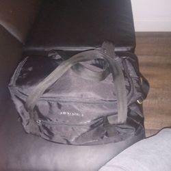 cosmetic bag associated with the brand Giorgio Armani. 