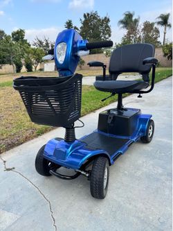Electric four-wheel mobility scooter