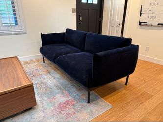 Modern blue velvet sofa
