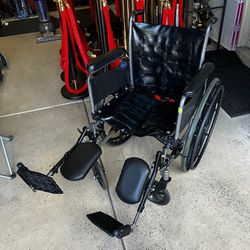 Wheelchair With Leg Elevating Footrests 