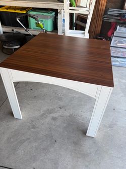 Table and three barstool chairs