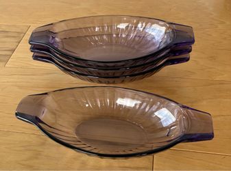 4 purple glass serving dishes, 4”X9”.