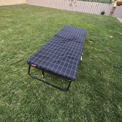 Portable Coleman Camping Bed Of An Adult.