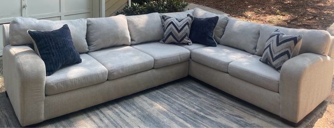 Beige 2pc sectional and pillows