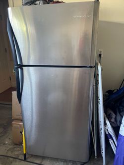 Frigidaire stainless steel fridge garage used works great