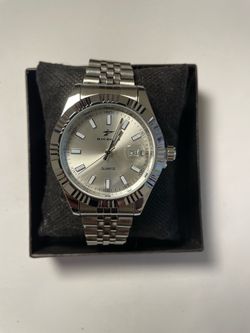 Silver and black watch with date display