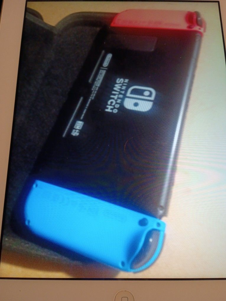NINTENDO SWITCH 32 GB HAND-HELD CONSOLE NEON RED/ NEON BLUE