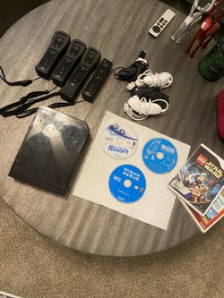 Nintendo Wii, 4 remotes, 4 nunchucks, + games