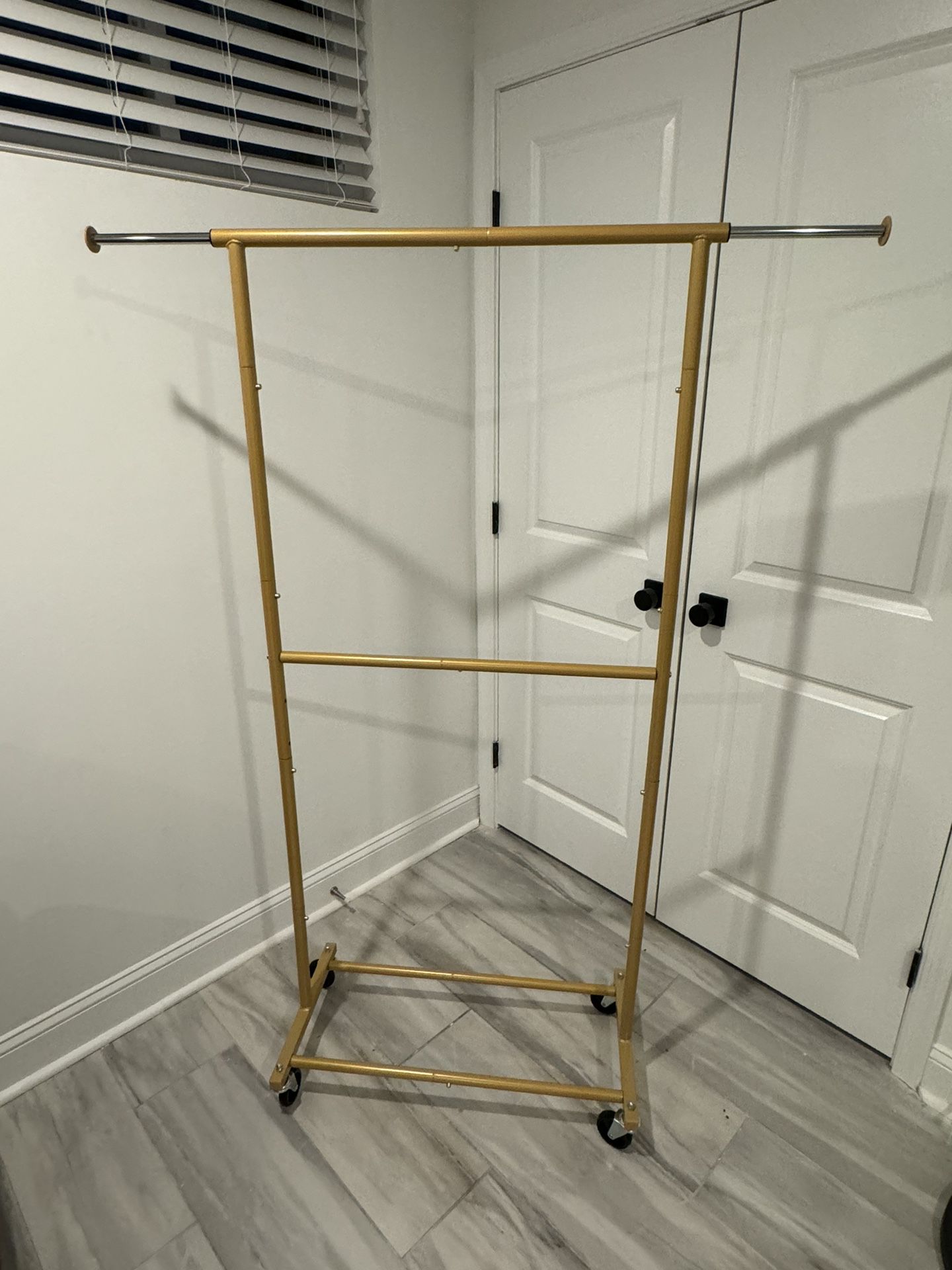Portable Gold Clothing Rack